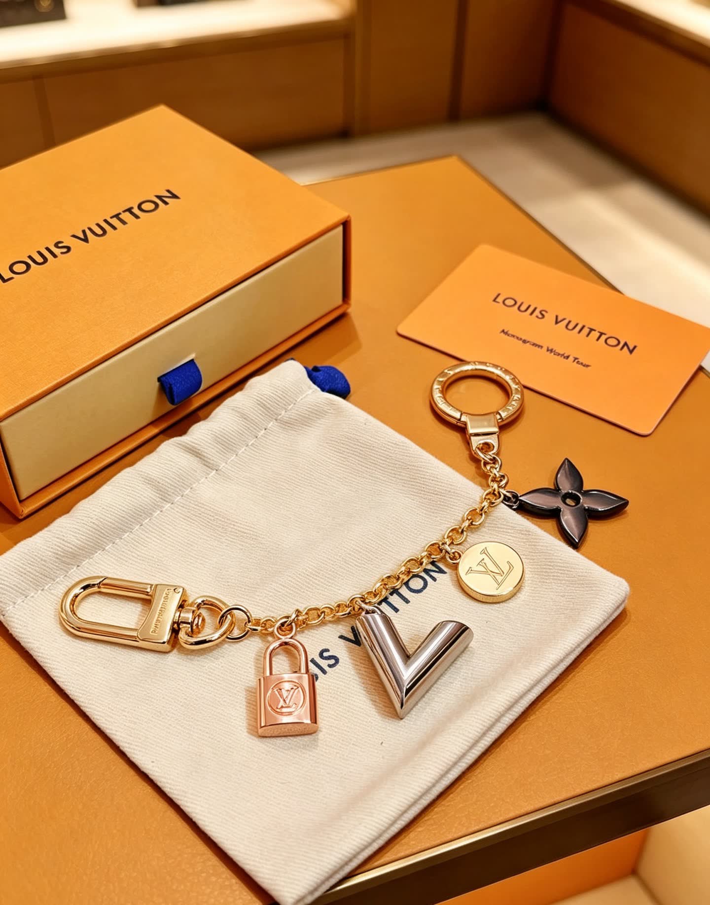 Louis Vuitton Keychain with Lock and Logo Charms Louis Vuitton Keychain with Lock and Logo Charms